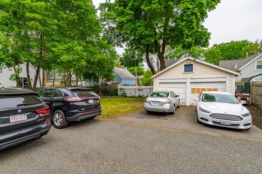 28 Walnut Street Natick, MA 01760 - Photo 5 of 24 a car parked in front of a house
