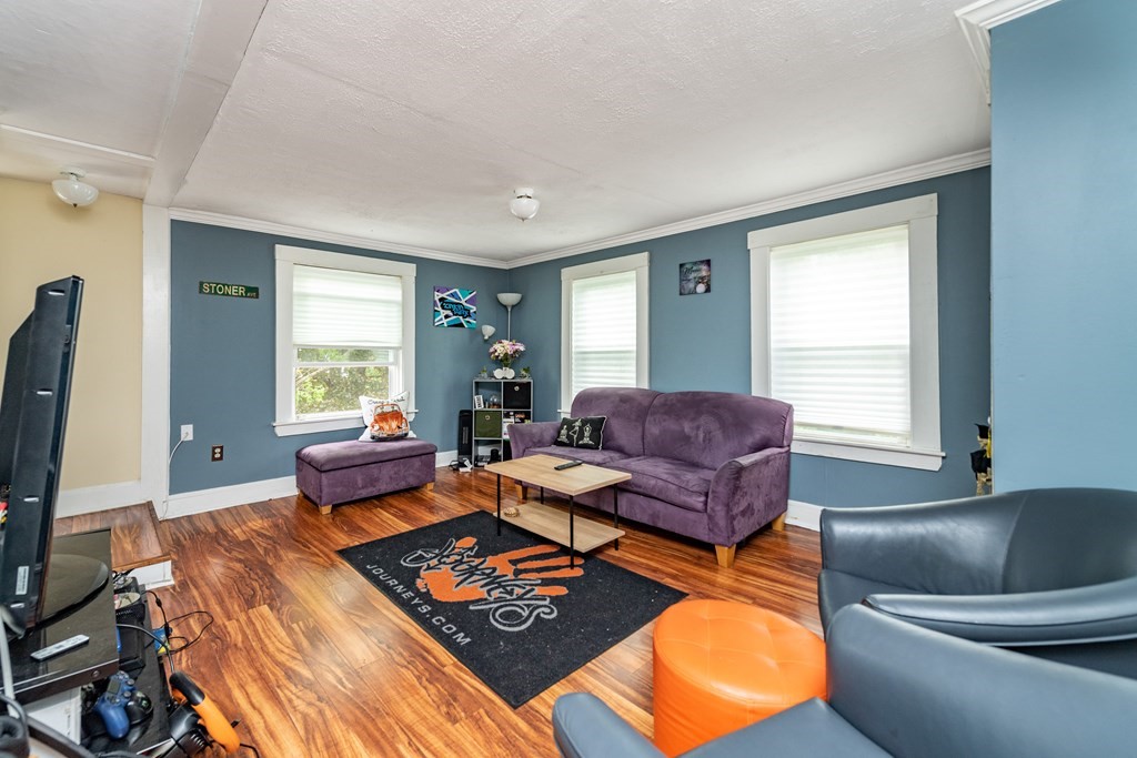 28 Walnut Street Natick, MA 01760 - Photo 9 of 24 a living room with furniture and a window