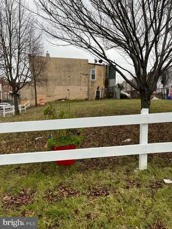 a view of house with wooden fence