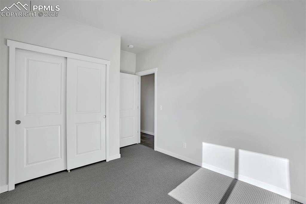 13605 Frost Bitten Grove Colorado Springs, CO 80921 - Photo 19 of 23 a view of an empty room