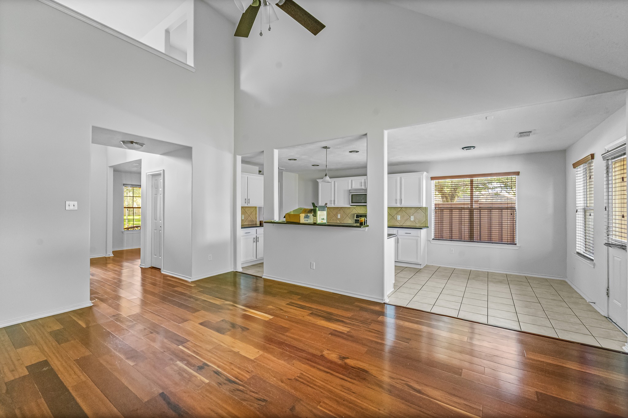 16210 Bloom Meadow Trail Cypress, TX 77433 - Photo 11 of 32 a view of an empty room with kitchen and window
