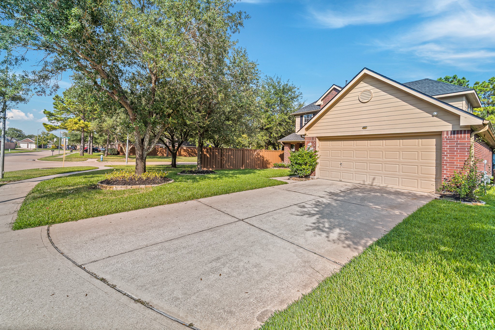16210 Bloom Meadow Trail Cypress, TX 77433 - Photo 2 of 32 a view of a house with a yard and large tree