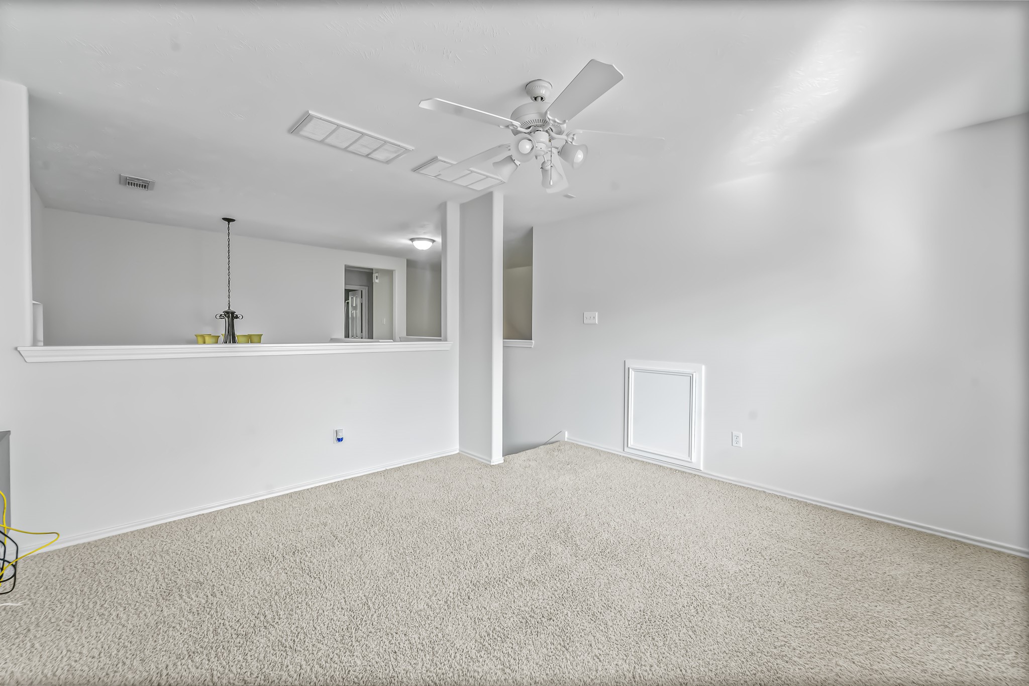 16210 Bloom Meadow Trail Cypress, TX 77433 - Photo 22 of 32 a view of a kitchen with a sink and a ceiling fan