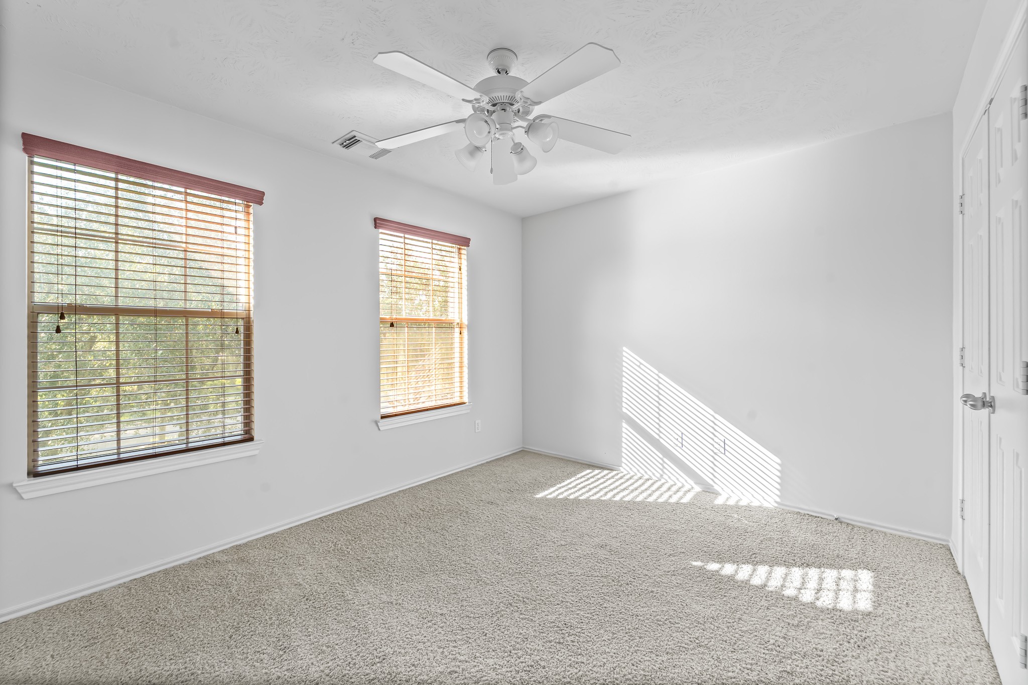 16210 Bloom Meadow Trail Cypress, TX 77433 - Photo 23 of 32 a view of an empty room with a window
