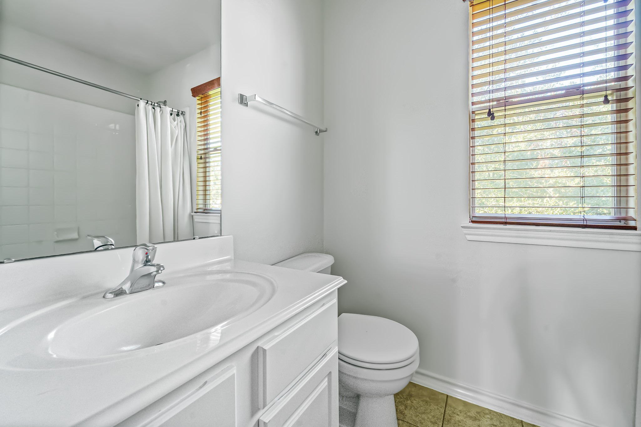 16210 Bloom Meadow Trail Cypress, TX 77433 - Photo 25 of 32 a bathroom with a sink toilet and shower