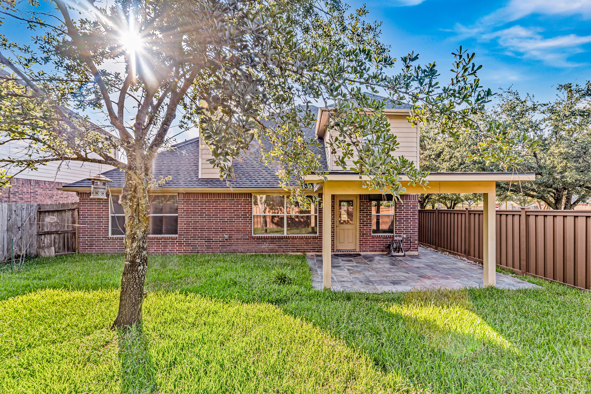 16210 Bloom Meadow Trail Cypress, TX 77433 - Photo 30 of 32 a front view of a house with a yard table and chairs