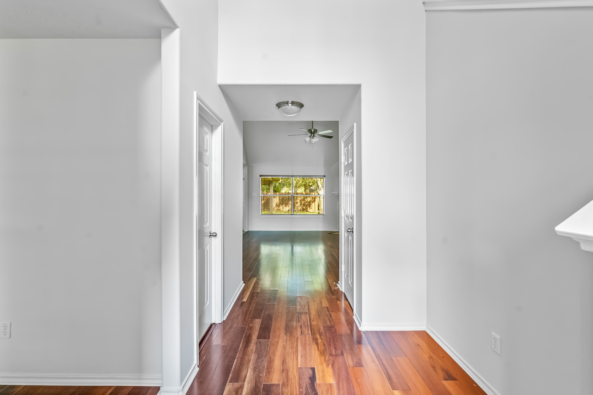 16210 Bloom Meadow Trail Cypress, TX 77433 - Photo 4 of 32 a view of a hallway with wooden floor