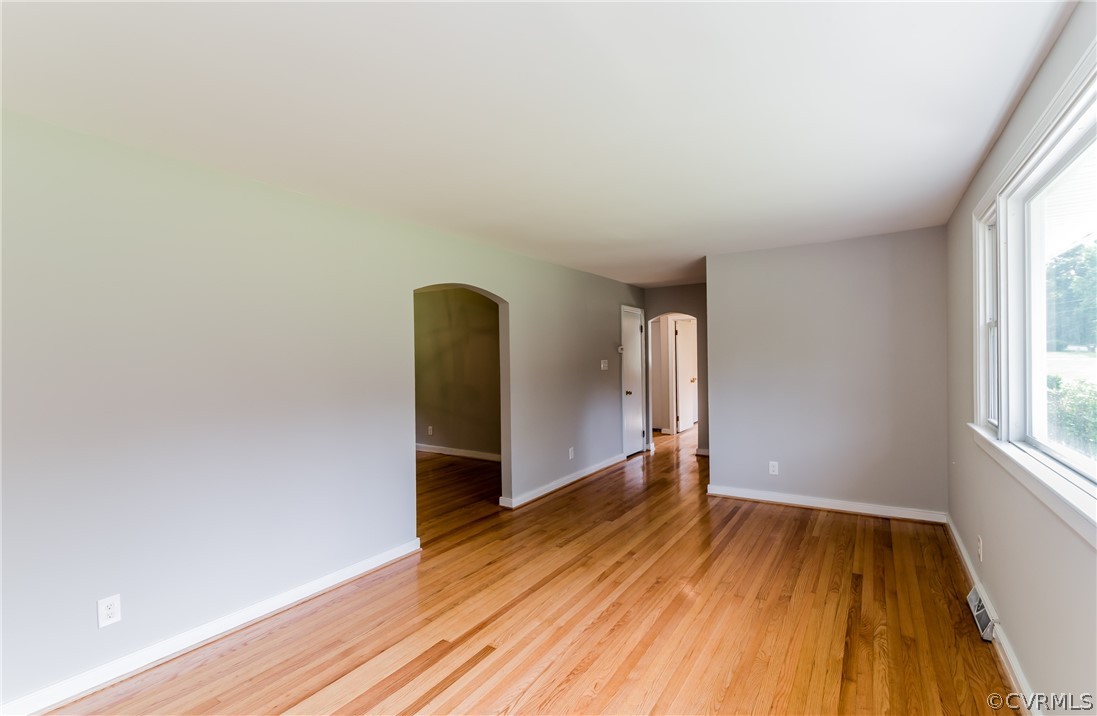 11407 Reedy Branch Road South Chesterfield, VA 23838 - Photo 12 of 50 an empty room with wooden floor and windows