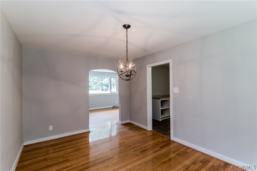 11407 Reedy Branch Road South Chesterfield, VA 23838 - Photo 13 of 50 a view of a room with wooden floor chandelier and closet