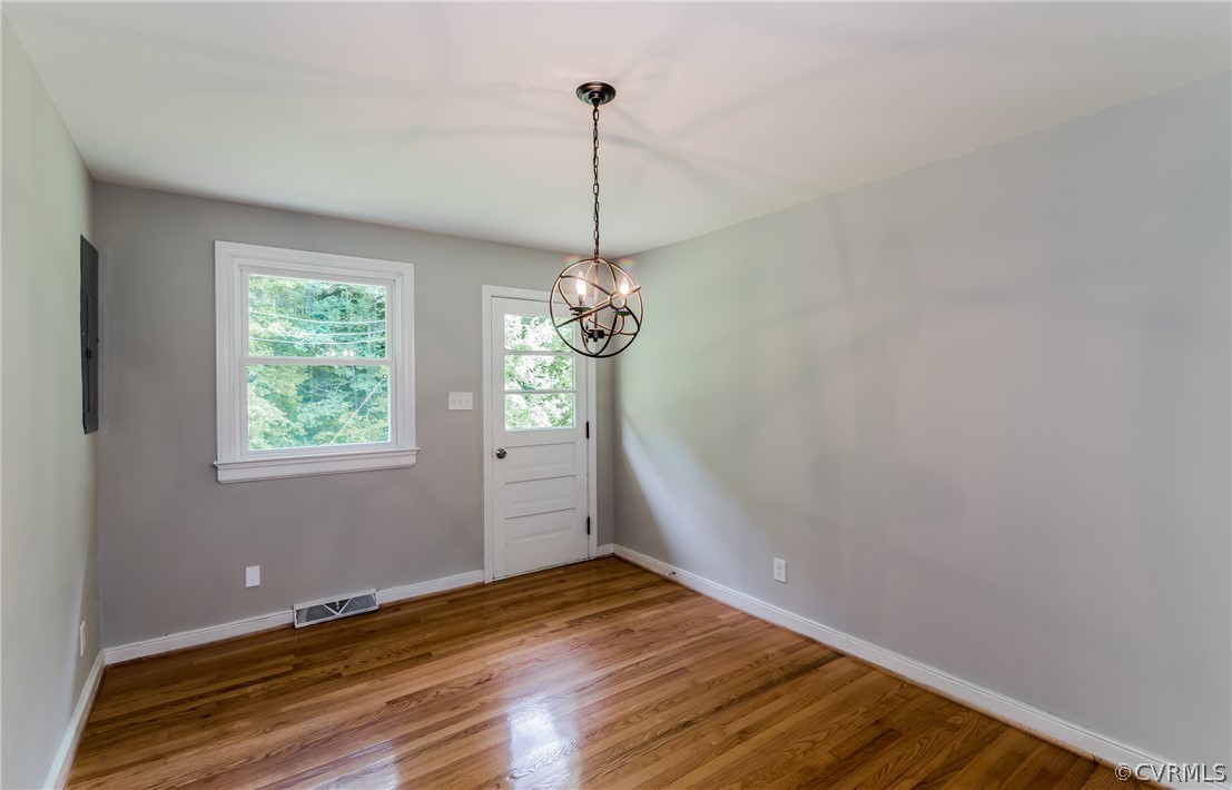 11407 Reedy Branch Road South Chesterfield, VA 23838 - Photo 14 of 50 a view of a room with wooden floor chandelier and window