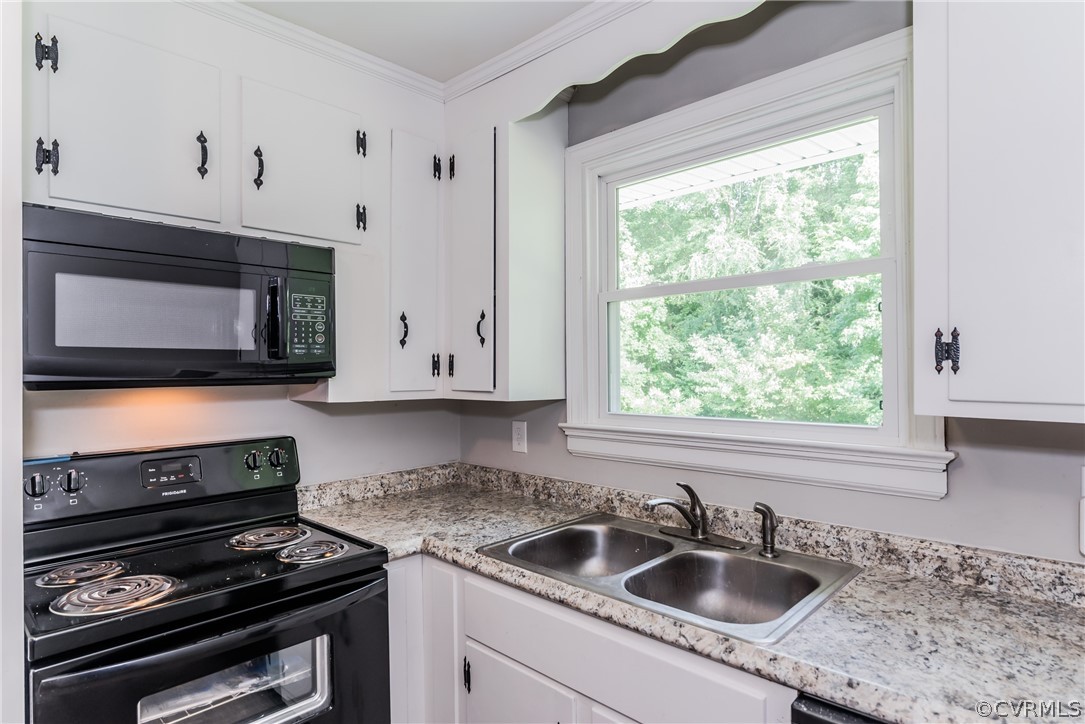 11407 Reedy Branch Road South Chesterfield, VA 23838 - Photo 20 of 50 a kitchen with granite countertop a sink cabinets and window