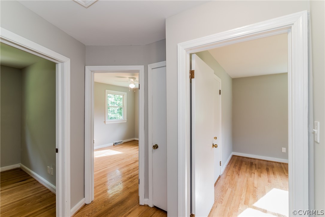 11407 Reedy Branch Road South Chesterfield, VA 23838 - Photo 24 of 50 a view of a hallway with wooden floor and a dining room