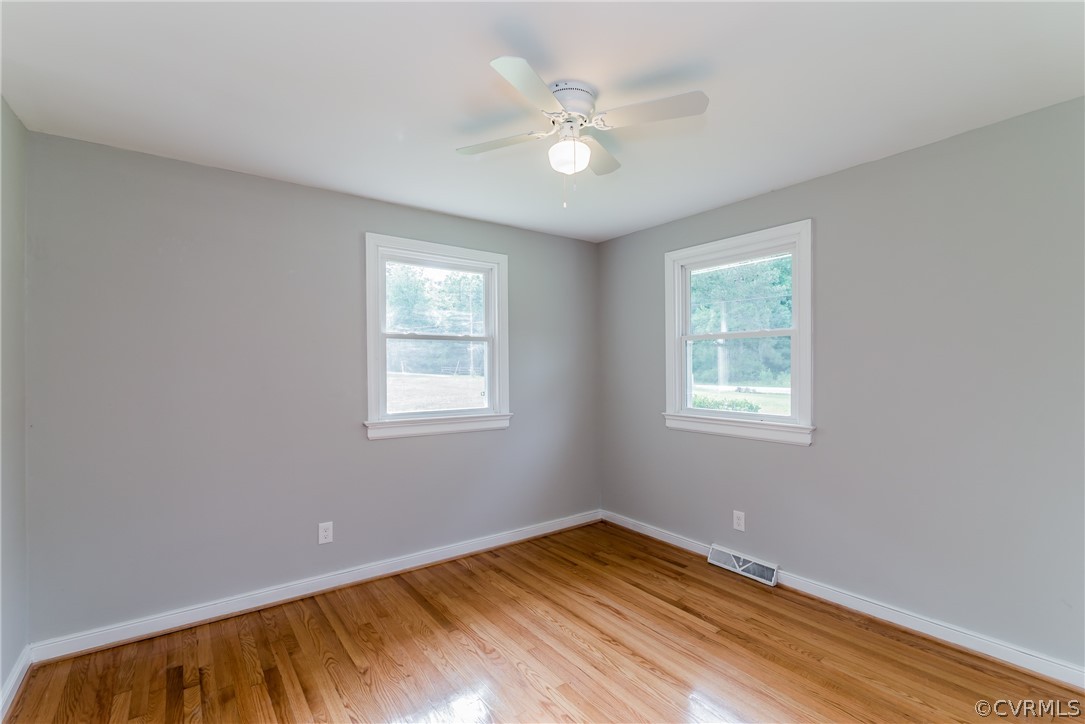 11407 Reedy Branch Road South Chesterfield, VA 23838 - Photo 25 of 50 a view of an empty room with window and wooden floor
