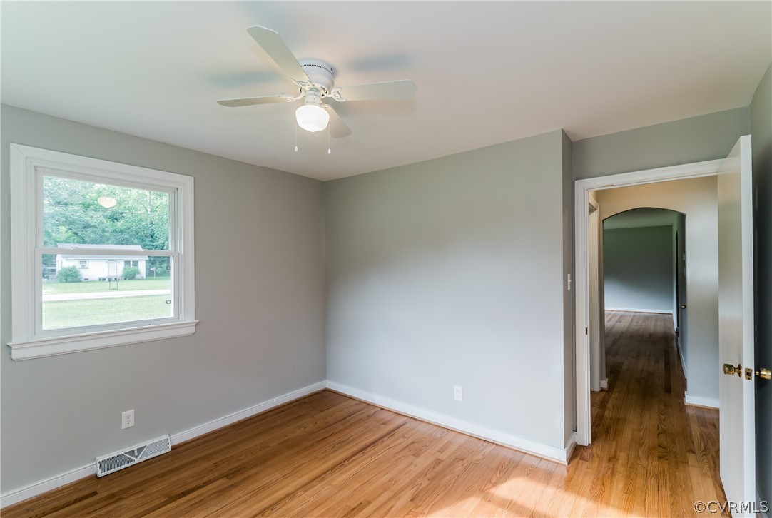 11407 Reedy Branch Road South Chesterfield, VA 23838 - Photo 26 of 50 a view of an empty room with wooden floor and a window