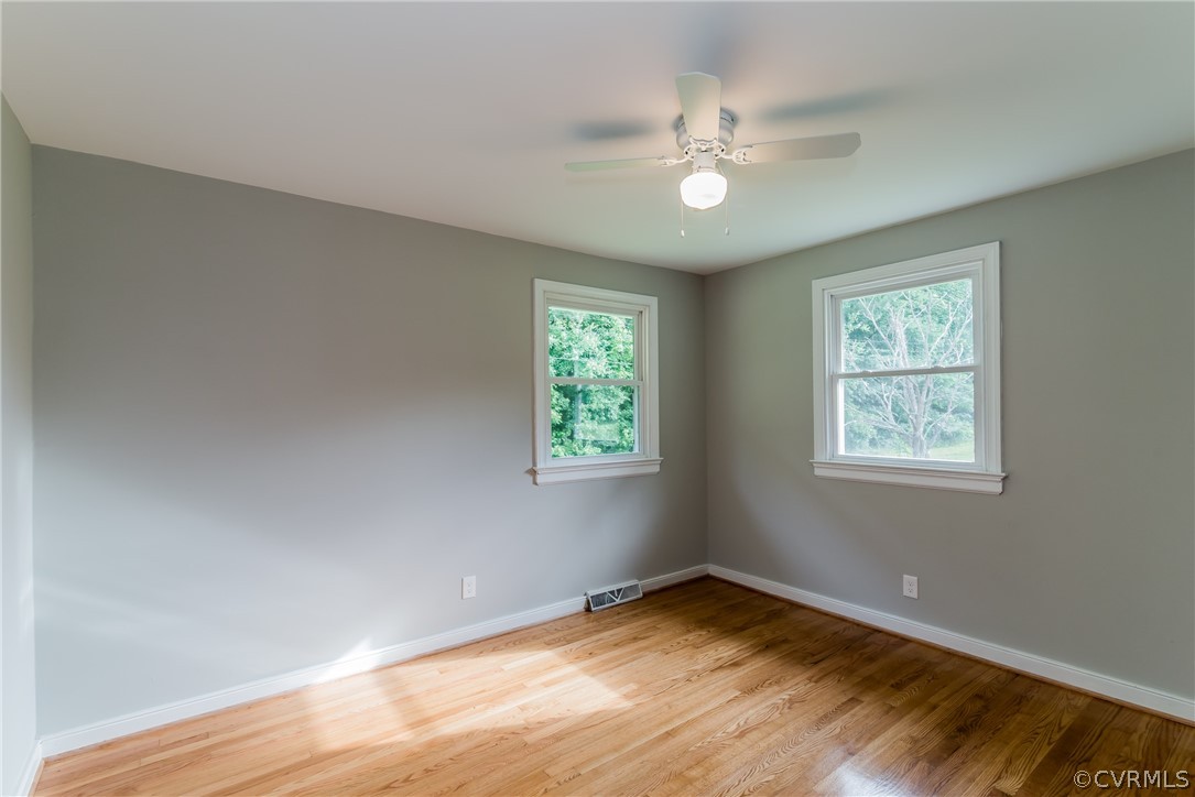 11407 Reedy Branch Road South Chesterfield, VA 23838 - Photo 33 of 50 a view of an empty room with wooden floor and a window