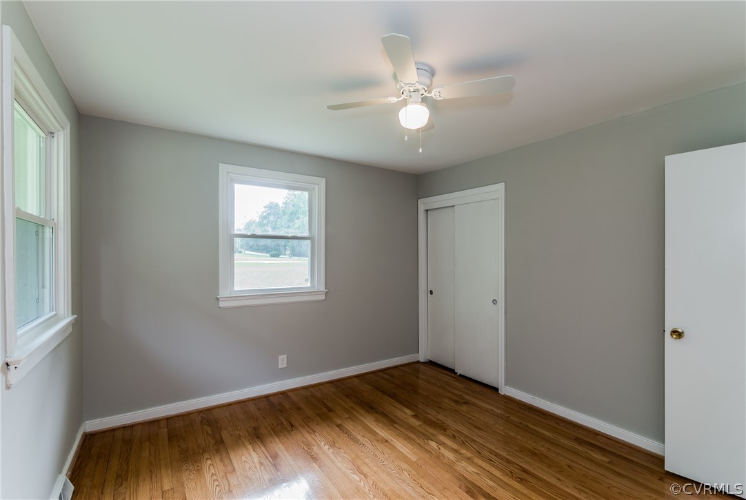 11407 Reedy Branch Road South Chesterfield, VA 23838 - Photo 34 of 50 a view of an empty room with wooden floor and a window