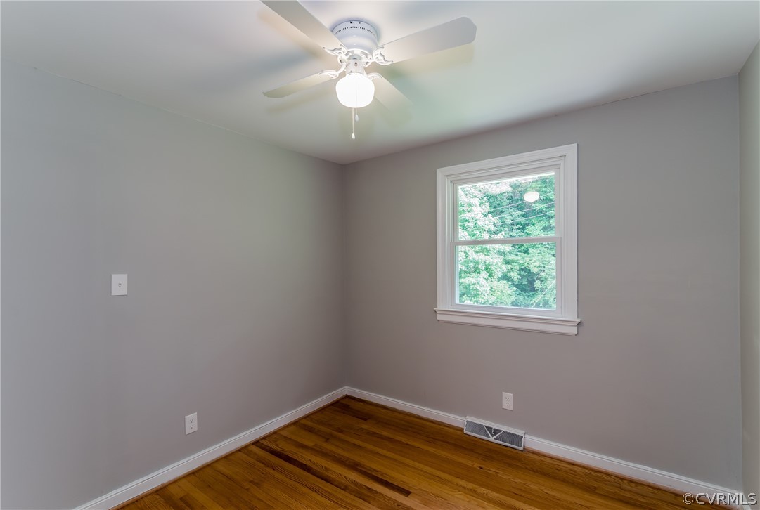 11407 Reedy Branch Road South Chesterfield, VA 23838 - Photo 36 of 50 an empty room with a window and a fan