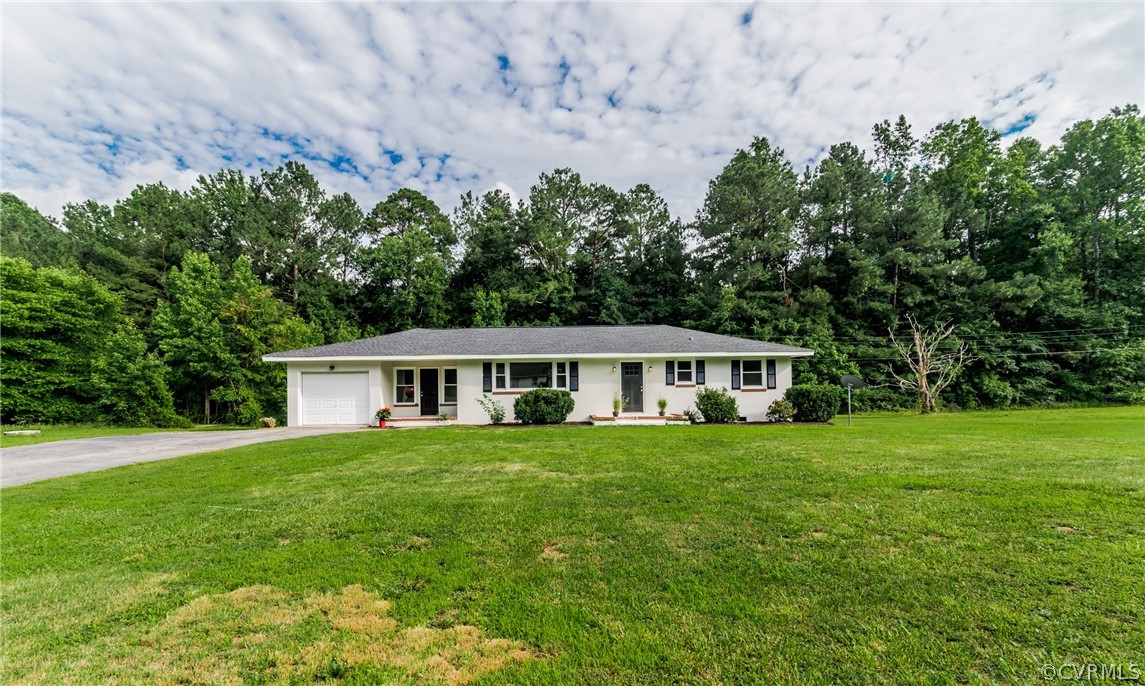 11407 Reedy Branch Road South Chesterfield, VA 23838 - Photo 5 of 50 a front view of a house with a garden