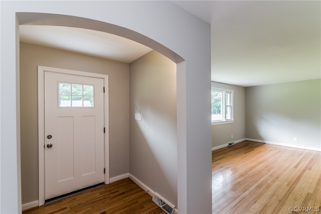 11407 Reedy Branch Road South Chesterfield, VA 23838 - Photo 7 of 50 a view of an empty room with wooden floor and a window