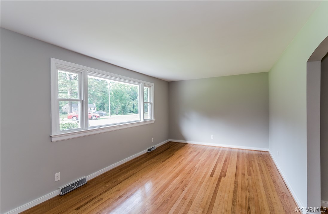 11407 Reedy Branch Road South Chesterfield, VA 23838 - Photo 9 of 50 an empty room with wooden floor and windows