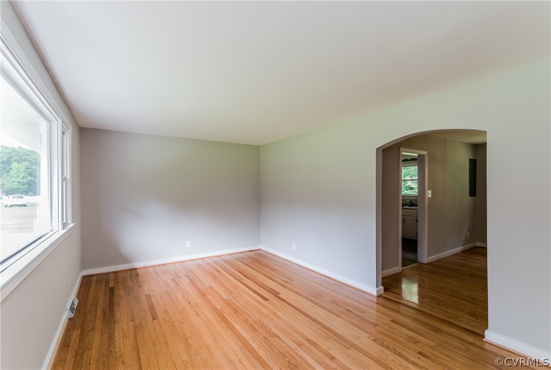 11407 Reedy Branch Road South Chesterfield, VA 23838 - Photo 10 of 50 an empty room with wooden floor and windows