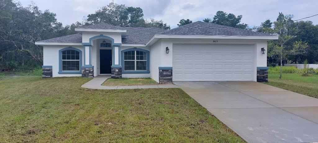 8423 Nittany Road Weeki Wachee, FL 34613 - Photo 1 of 1 a front view of a house with a yard