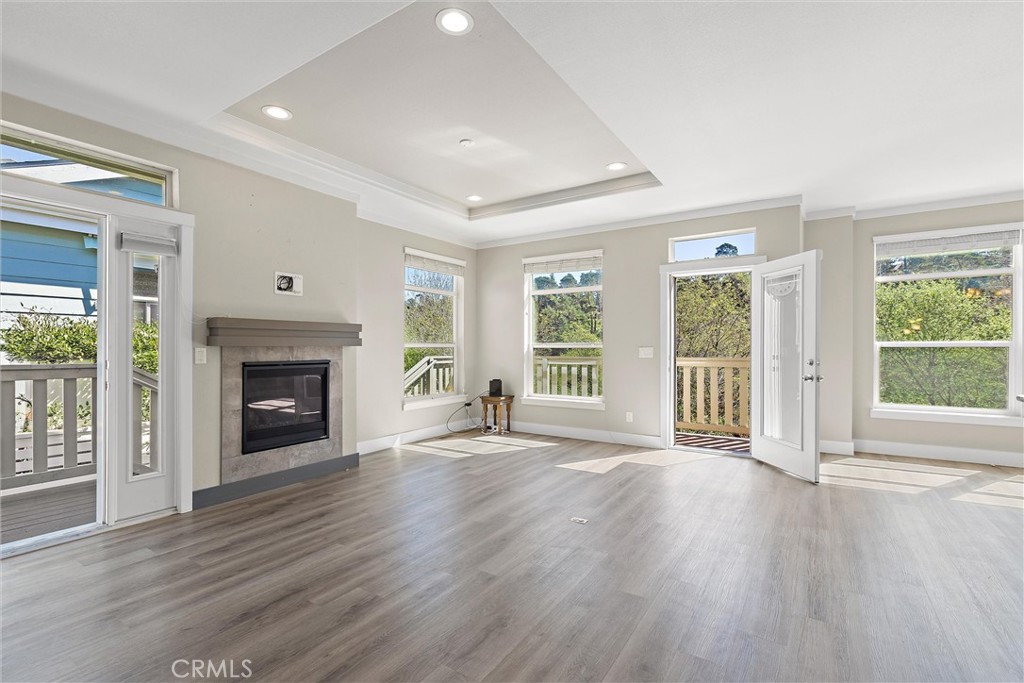 1460 Main Street, Unit 112 Cambria, CA 93428 - Photo 19 of 19 a view of an empty room with wooden floor and a window
