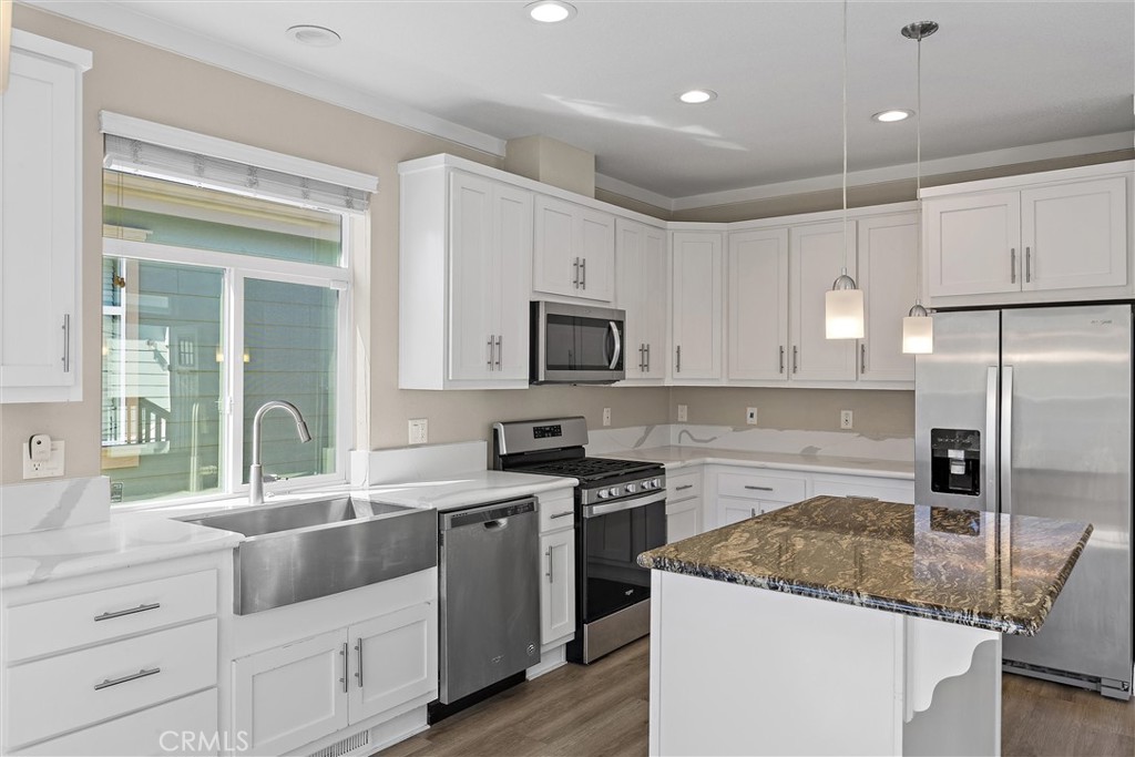 1460 Main Street, Unit 112 Cambria, CA 93428 - Photo 2 of 19 a kitchen with a sink stove and refrigerator