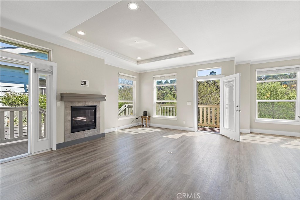 1460 Main Street, Unit 112 Cambria, CA 93428 - Photo 3 of 19 a view of an empty room with wooden floor and a window