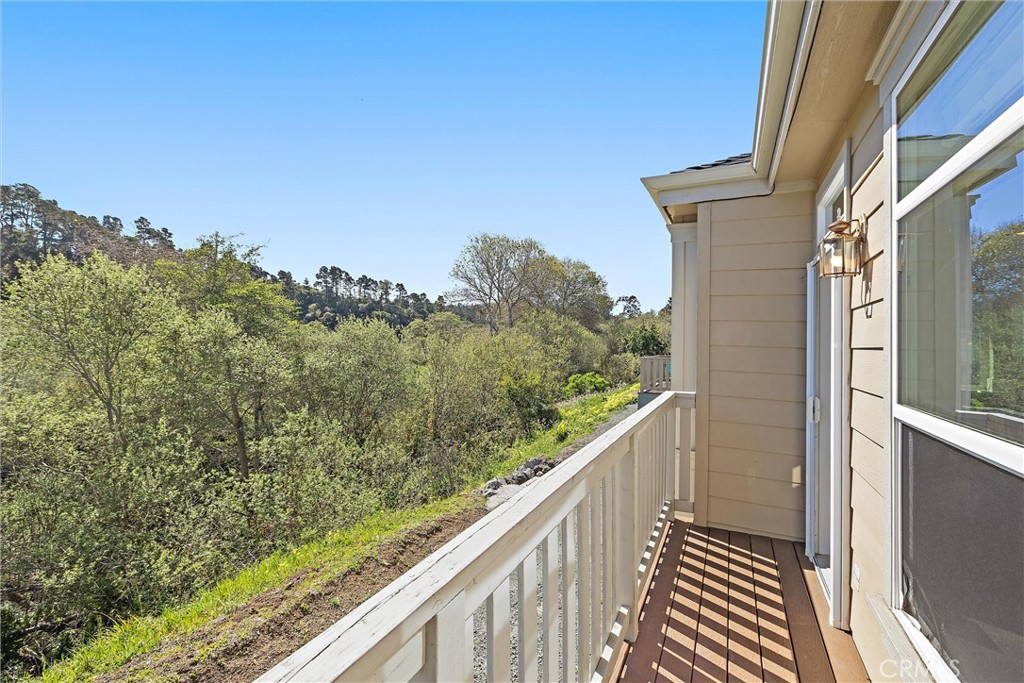 1460 Main Street, Unit 112 Cambria, CA 93428 - Photo 4 of 19 a view of a balcony with wooden fence and floor