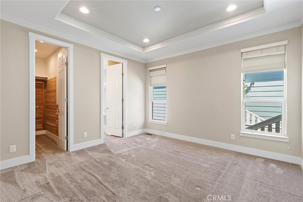 1460 Main Street, Unit 112 Cambria, CA 93428 - Photo 6 of 19 an empty room with windows and closet