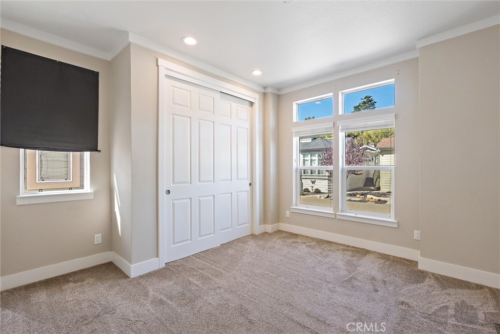 1460 Main Street, Unit 112 Cambria, CA 93428 - Photo 9 of 19 a view of an empty room with a window