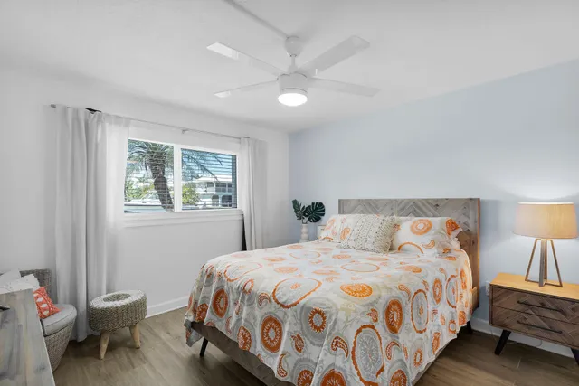 a bedroom with bed and a flat screen tv