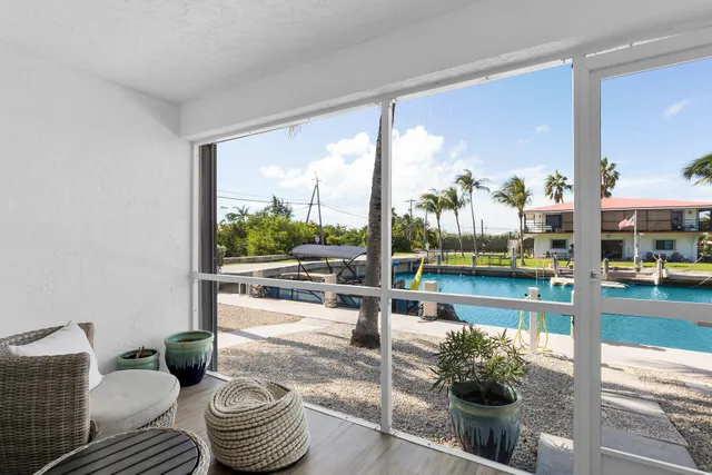 a room with furniture and a potted plant