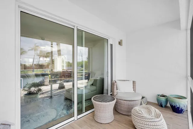 a view of a dinning table and chairs in patio