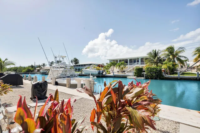a view of a chairs and table in patio