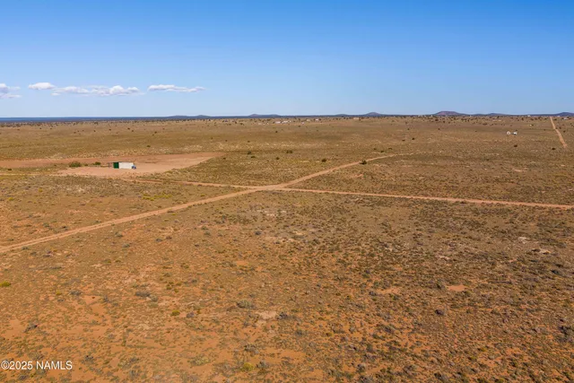 a view of an ocean beach and mountain