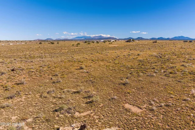 a view of an ocean beach and mountain