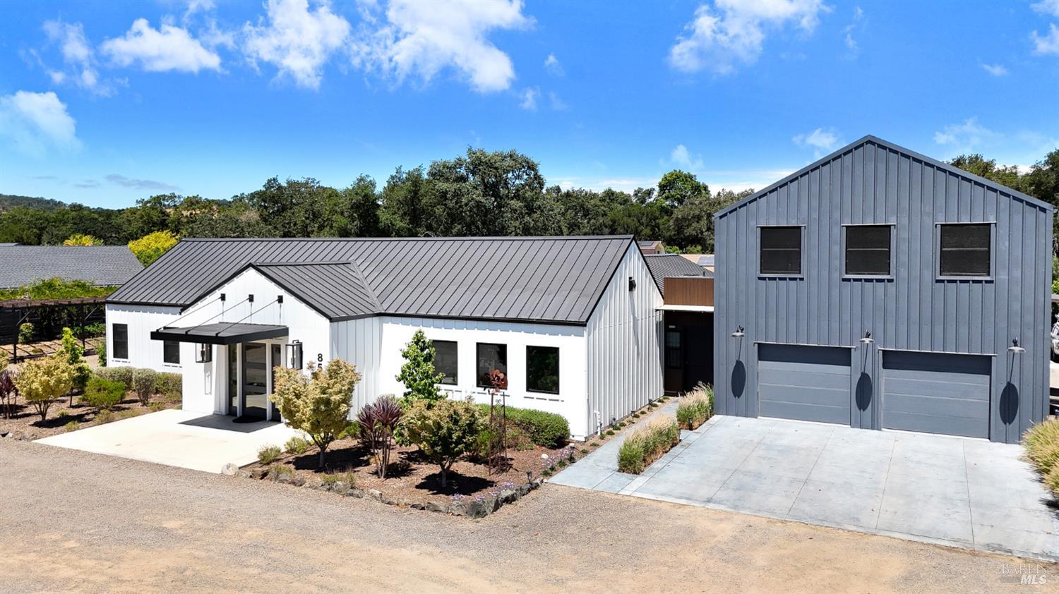 85 Trinity Road Glen Ellen, CA 95442 - Photo 1 of 62 a front view of a house with a yard and garage