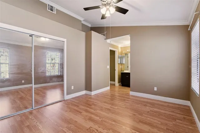 a spacious bathroom with a granite countertop sink toilet and shower