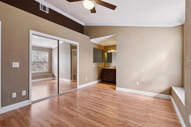 a bathroom with a bathtub shower sink vanity and toilet