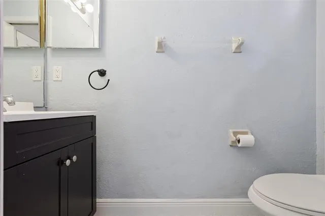 a view of a porch with a table and chairs