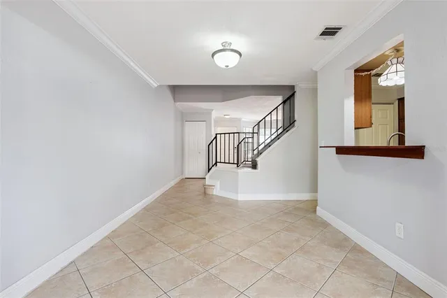 a view of staircase with white walls