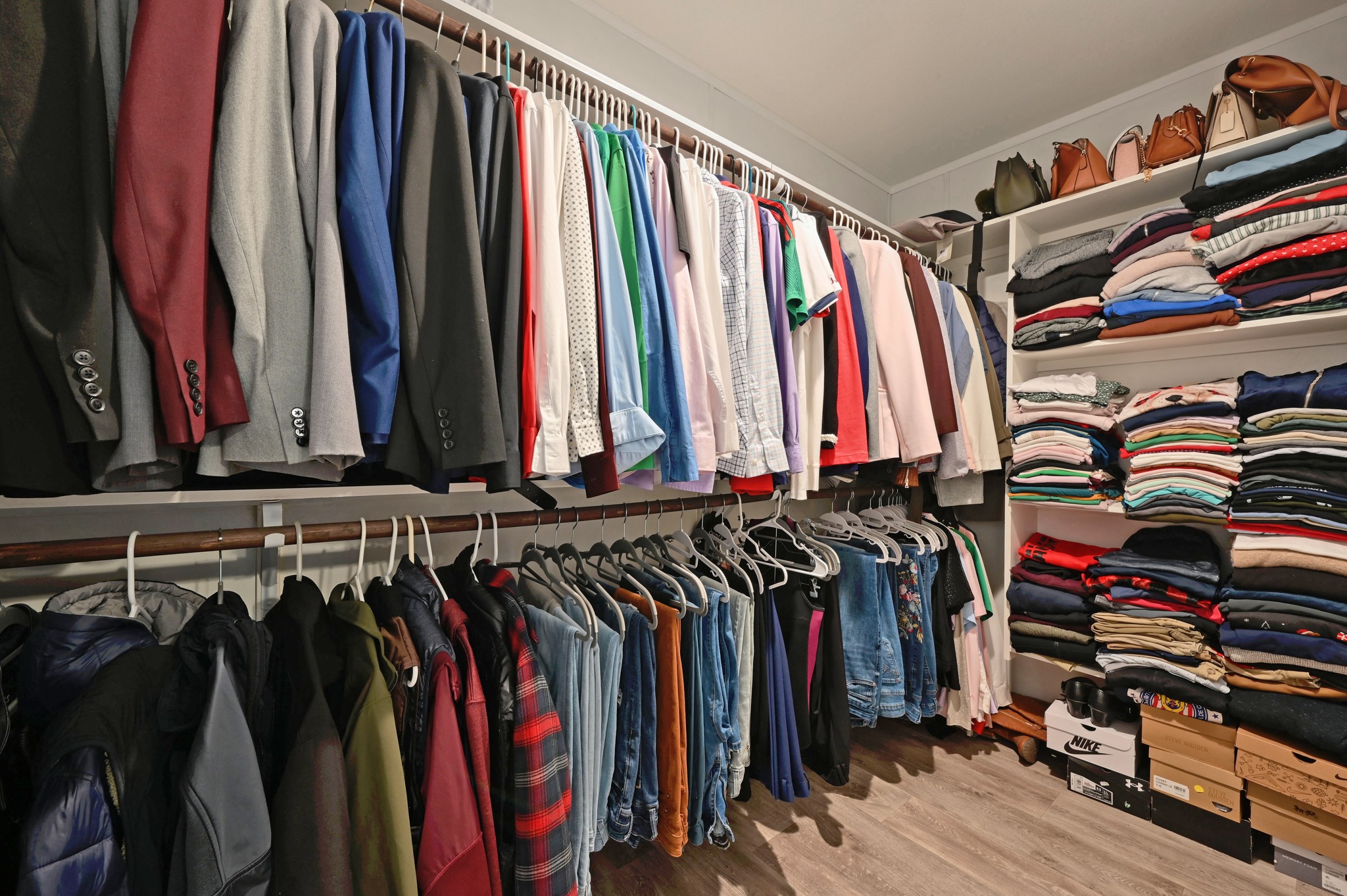 117 Castellana Way Elgin, TX 78621 - Photo 15 of 28 Walk in closet featuring light wood-style floors