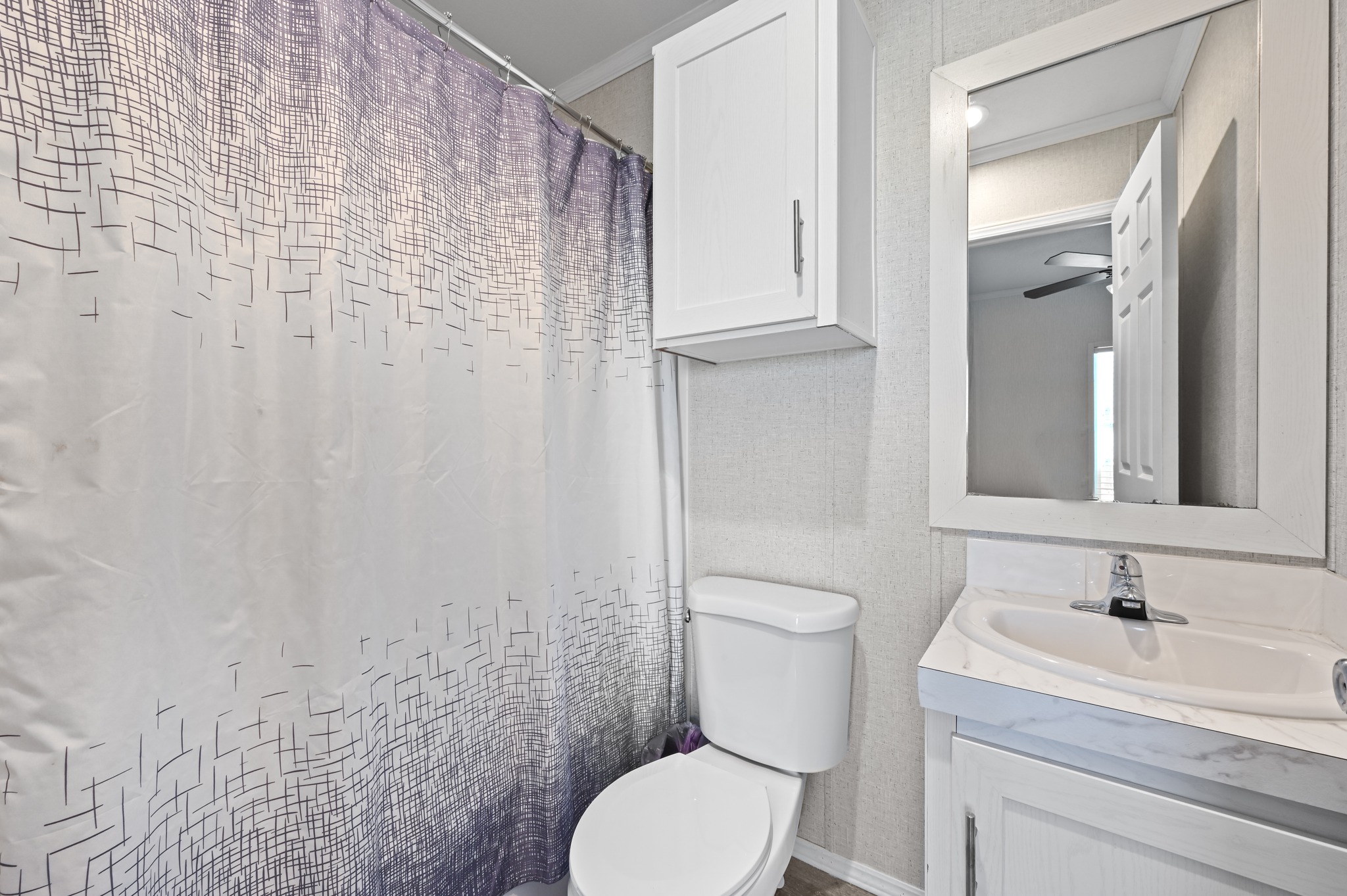 117 Castellana Way Elgin, TX 78621 - Photo 19 of 28 Bathroom with vanity and a shower with curtain