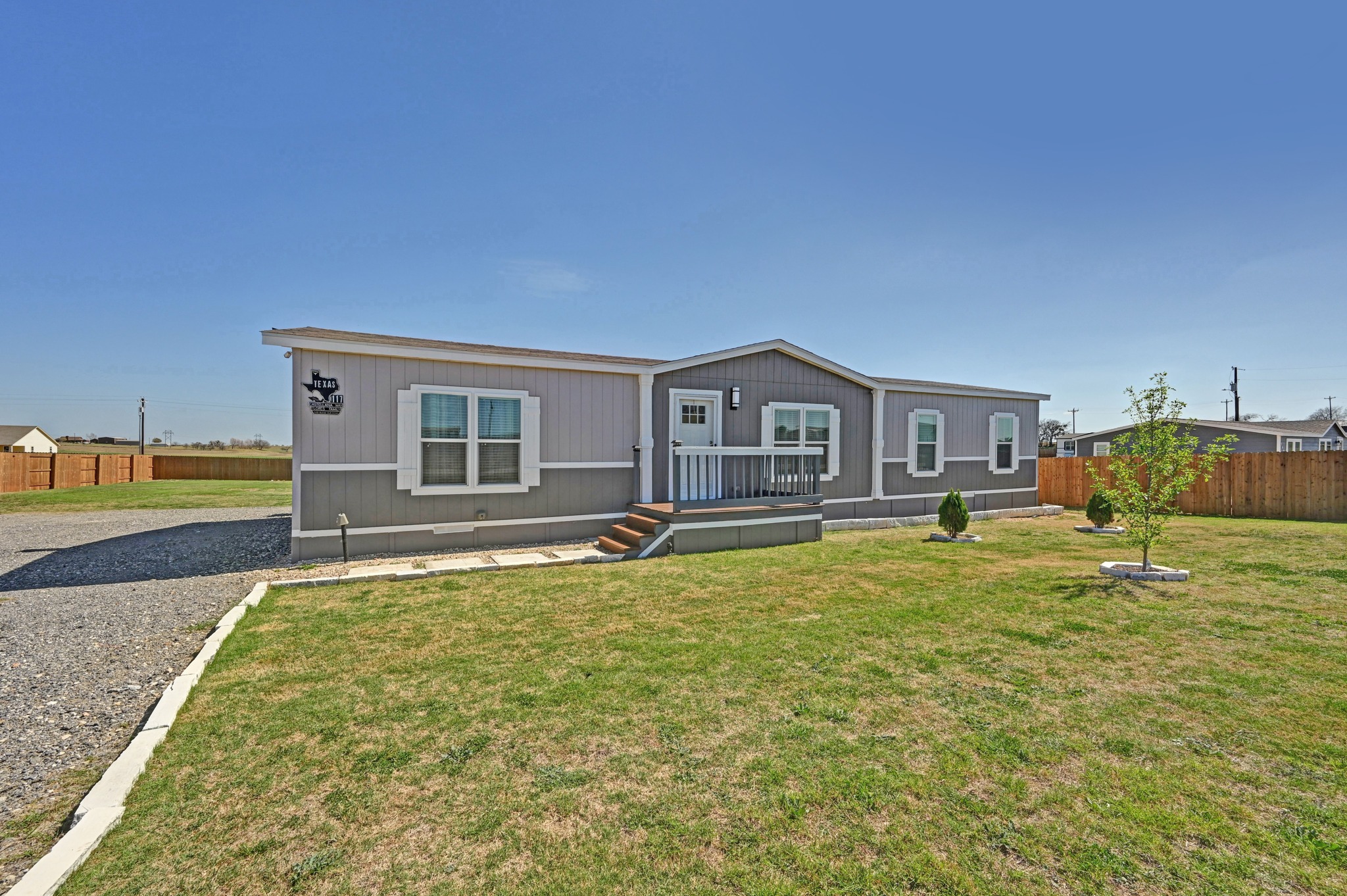 117 Castellana Way Elgin, TX 78621 - Photo 2 of 28 View of front facade featuring a deck
