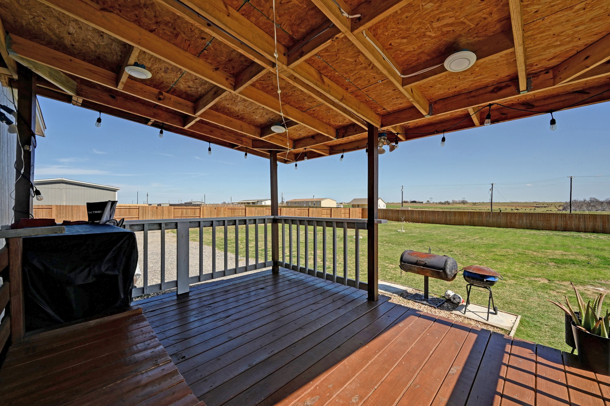 117 Castellana Way Elgin, TX 78621 - Photo 21 of 28 Deck with a fenced backyard and area for grilling