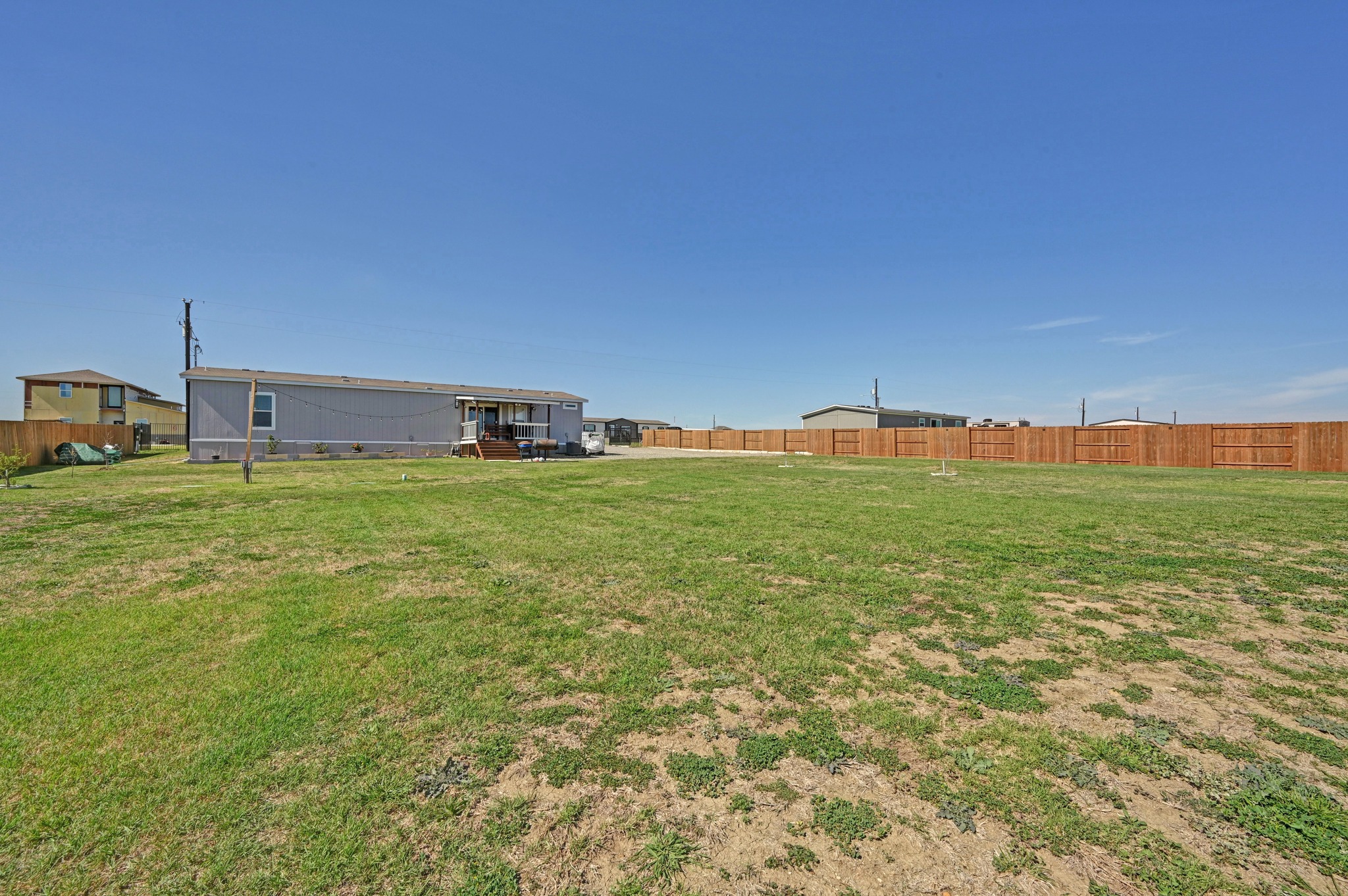117 Castellana Way Elgin, TX 78621 - Photo 25 of 28 View of fenced yard