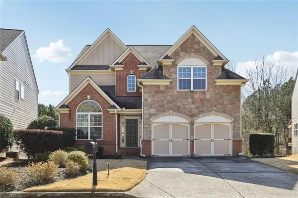 a front view of a house with a yard