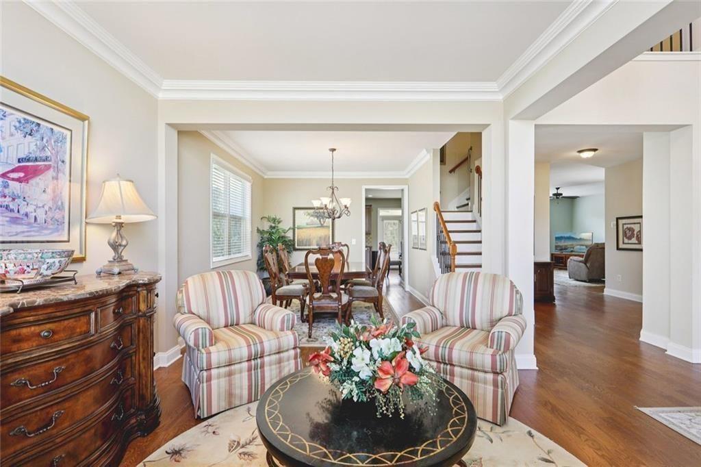 4460 Granby Circle Cumming, GA 30041 - Photo 11 of 34 a living room with furniture and a potted plant